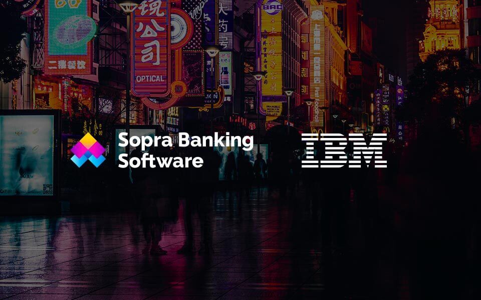 crowded street at night with Sopra Banking Software and IBM written